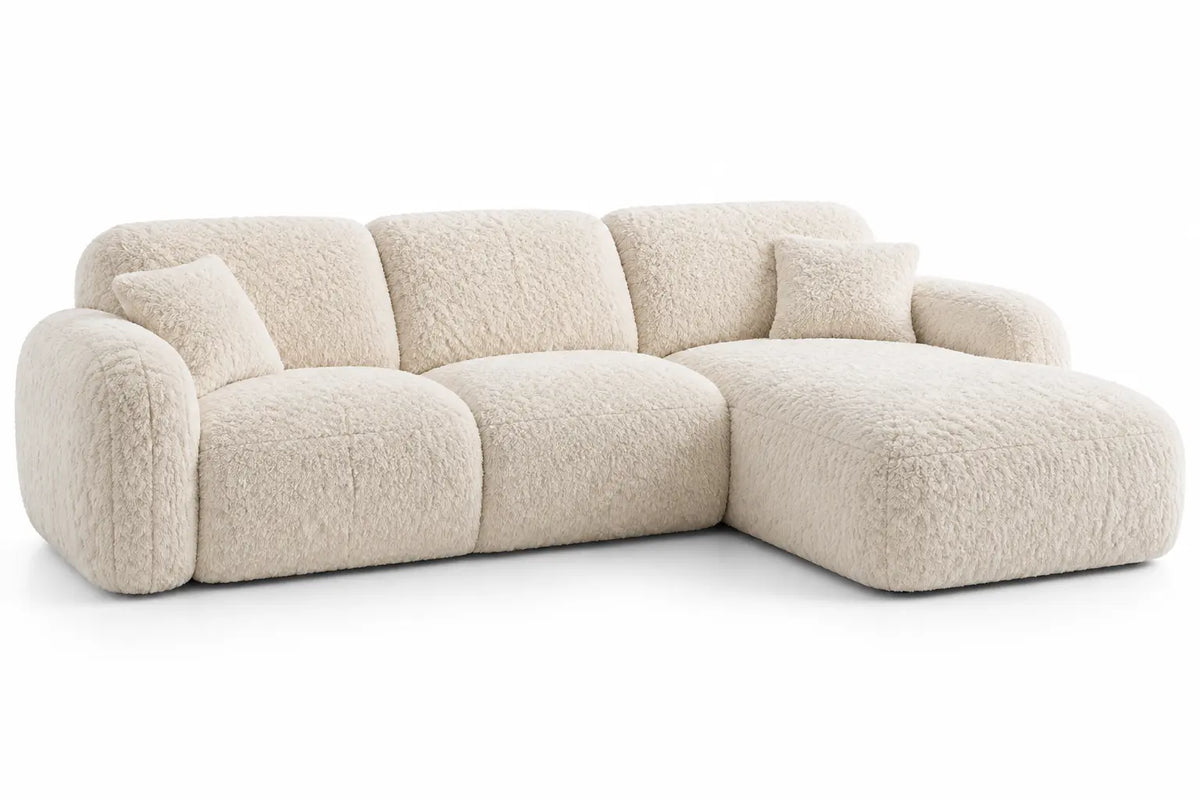 Beige L-shaped sofa with rounded edges from Heatproofbenchhaven, perfect for modern living rooms.