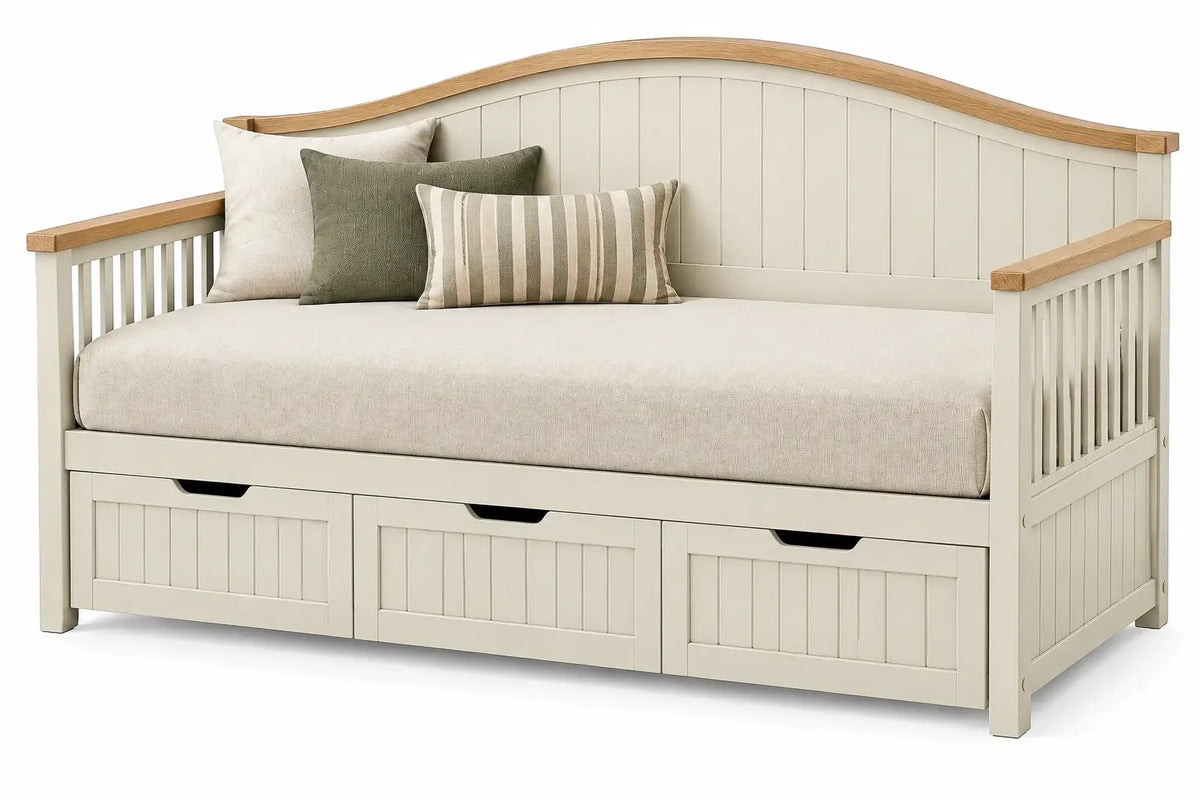 White upholstered divan with curved design and built-in storage drawers, ideal as a stylish and functional furniture piece.